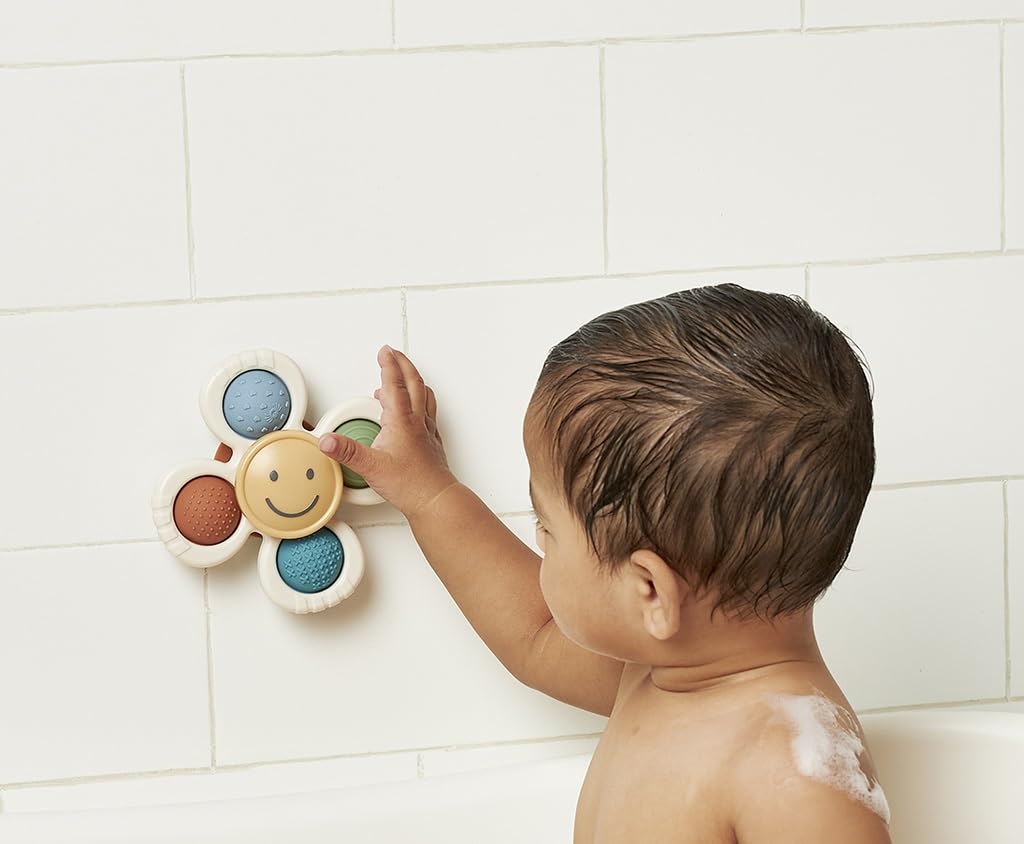 Itzy Ritzy Fidget Toy with Sensory Poppers & Suction Cup; Fidget Toy Sticks to Highchairs, Tables or Tubs While Spinning & Engaging Baby with 4 Textured Poppers, Smile